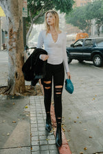 Load image into Gallery viewer, HIGH RISE DISTRESSED SKINNY W RAW HEM
