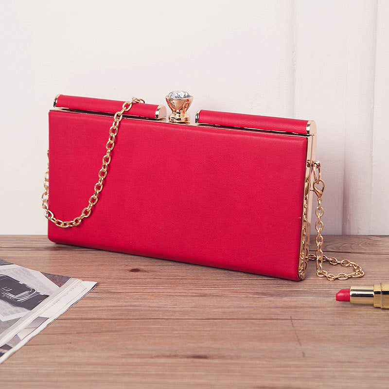 Adele Chain Handle Leather Clutch